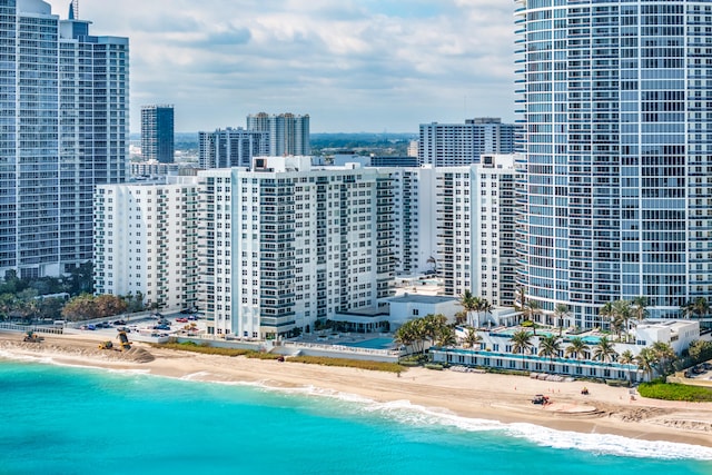 exterior space with a water view and a view of the beach