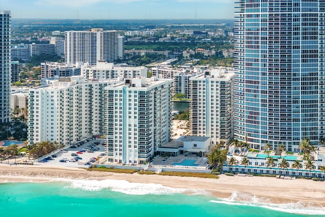 aerial view with a water view and a view of the beach