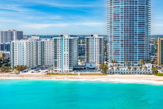 bird's eye view featuring a view of the beach and a water view