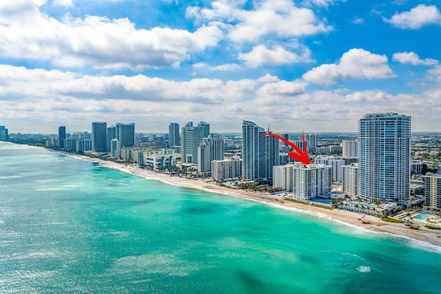 bird's eye view with a view of the beach and a water view