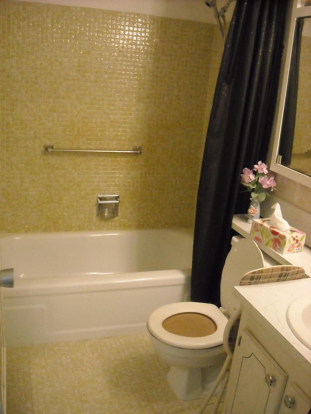 full bathroom with toilet, tile flooring, shower / tub combo, and vanity