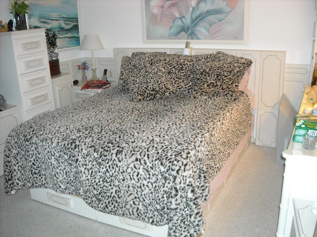 bedroom with light colored carpet