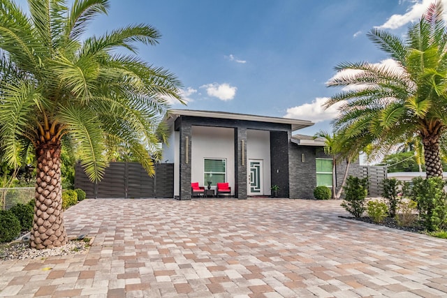 exterior space featuring fence and stucco siding