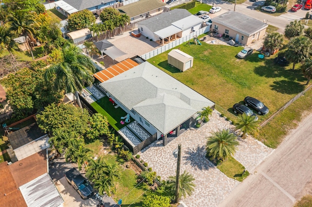 birds eye view of property with a residential view