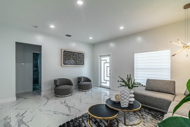 living area featuring baseboards, marble finish floor, visible vents, and recessed lighting