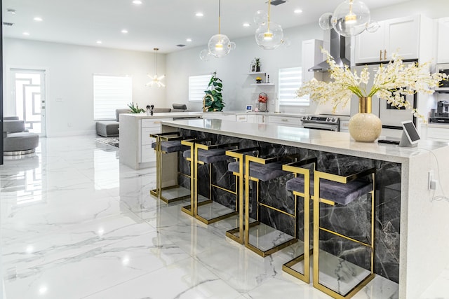 kitchen featuring stainless steel electric range oven, marble finish floor, white cabinetry, and recessed lighting