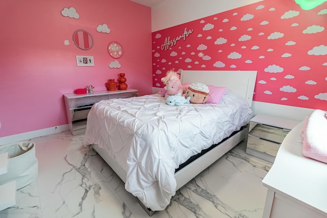 bedroom featuring marble finish floor and baseboards