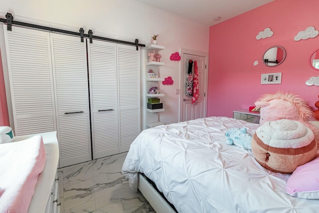 bedroom with marble finish floor and a closet