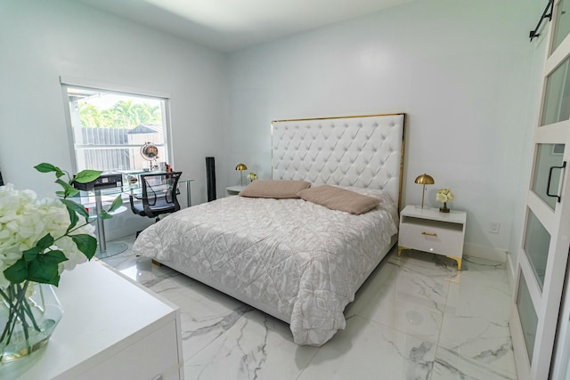 bedroom with marble finish floor and baseboards