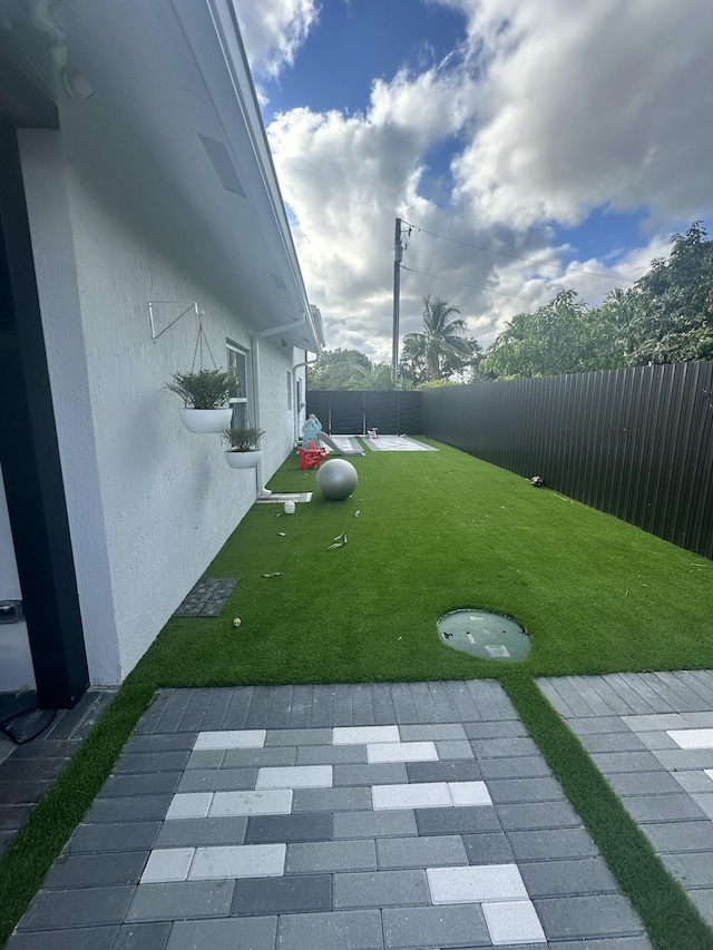 view of yard with a patio area