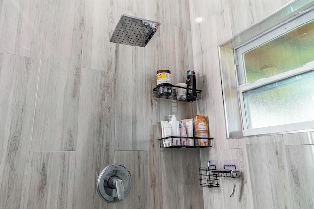 bathroom with a tile shower