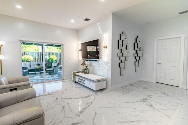 living area featuring marble finish floor, baseboards, visible vents, and recessed lighting