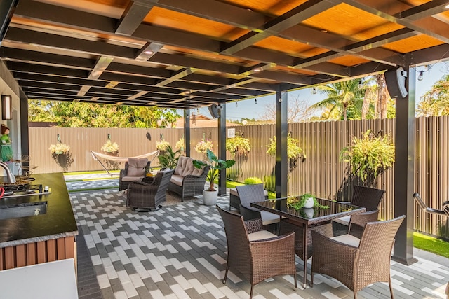 view of patio featuring outdoor dining area and a fenced backyard