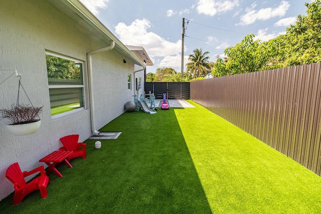 view of yard with a fenced backyard