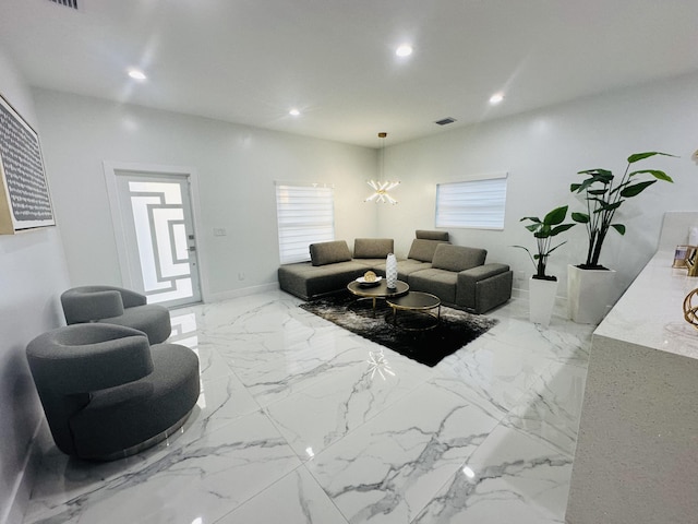 living room with an inviting chandelier