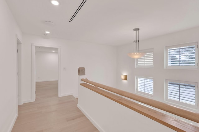 hall with light hardwood / wood-style flooring