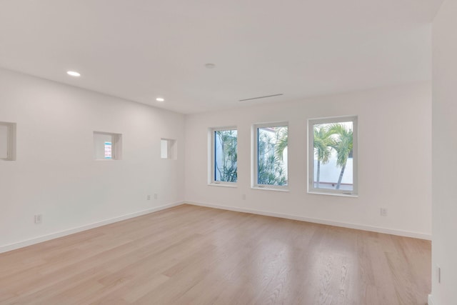 spare room featuring light wood-type flooring