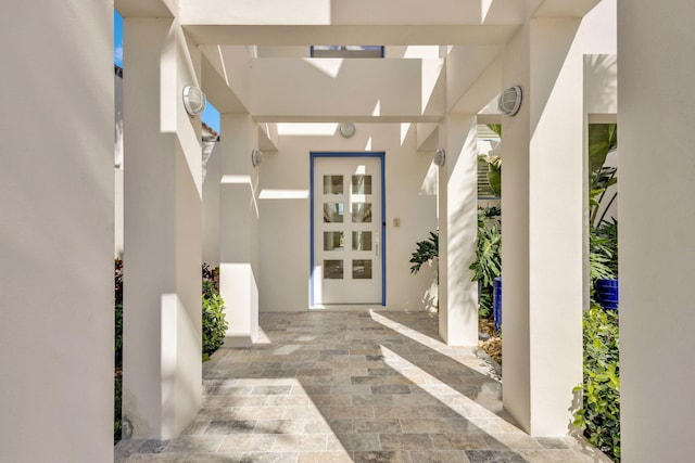 property entrance with french doors and a patio area