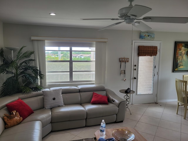 living room with ceiling fan and light tile floors