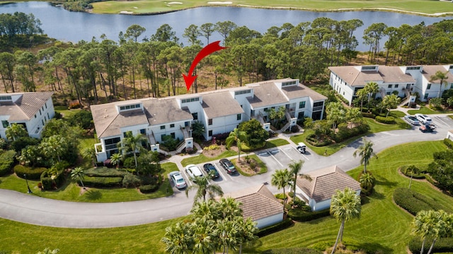 birds eye view of property with a water view