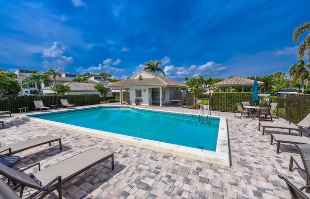 view of pool featuring a gazebo and a patio