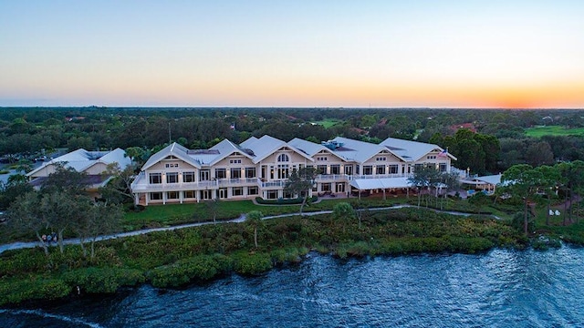 aerial view at dusk with a water view