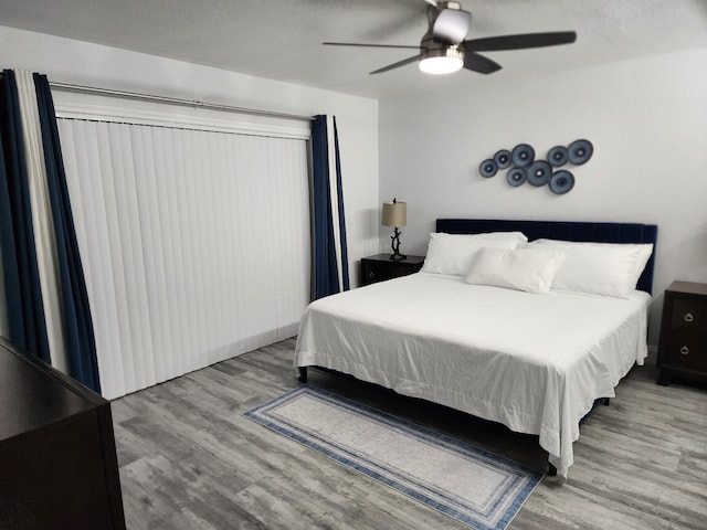 bedroom featuring ceiling fan and light hardwood / wood-style floors