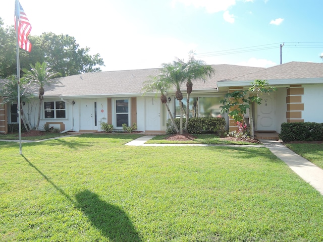 single story home with a front lawn