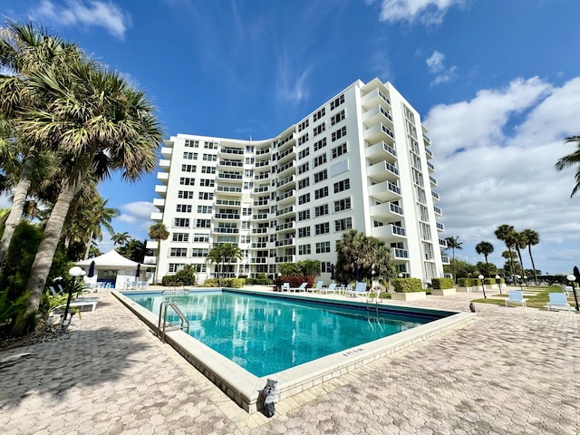 community pool with a patio area