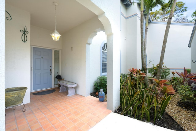 property entrance featuring a patio area