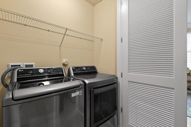 laundry area featuring washing machine and dryer