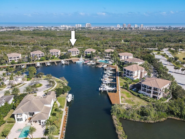 birds eye view of property with a water view