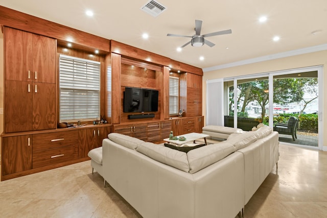 living room featuring crown molding and ceiling fan