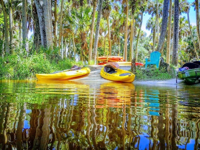 surrounding community with a water view