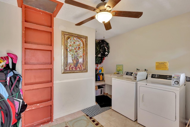 laundry area featuring separate washer and dryer, ceiling fan, and light tile patterned flooring