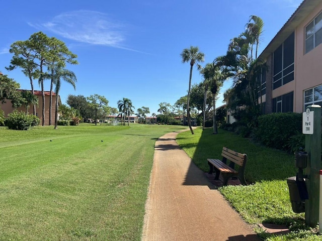 view of home's community with a lawn