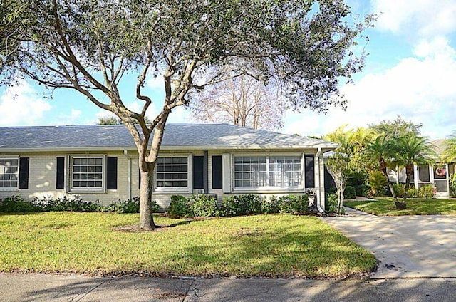 ranch-style home with a front yard