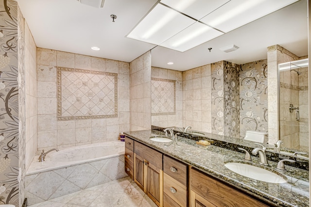 full bathroom with vanity, toilet, tile walls, and plus walk in shower