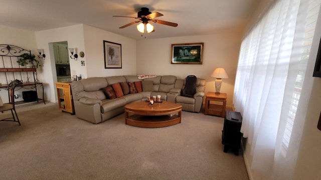 living room featuring light carpet and ceiling fan