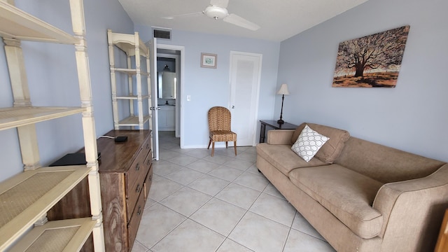 tiled living room featuring ceiling fan