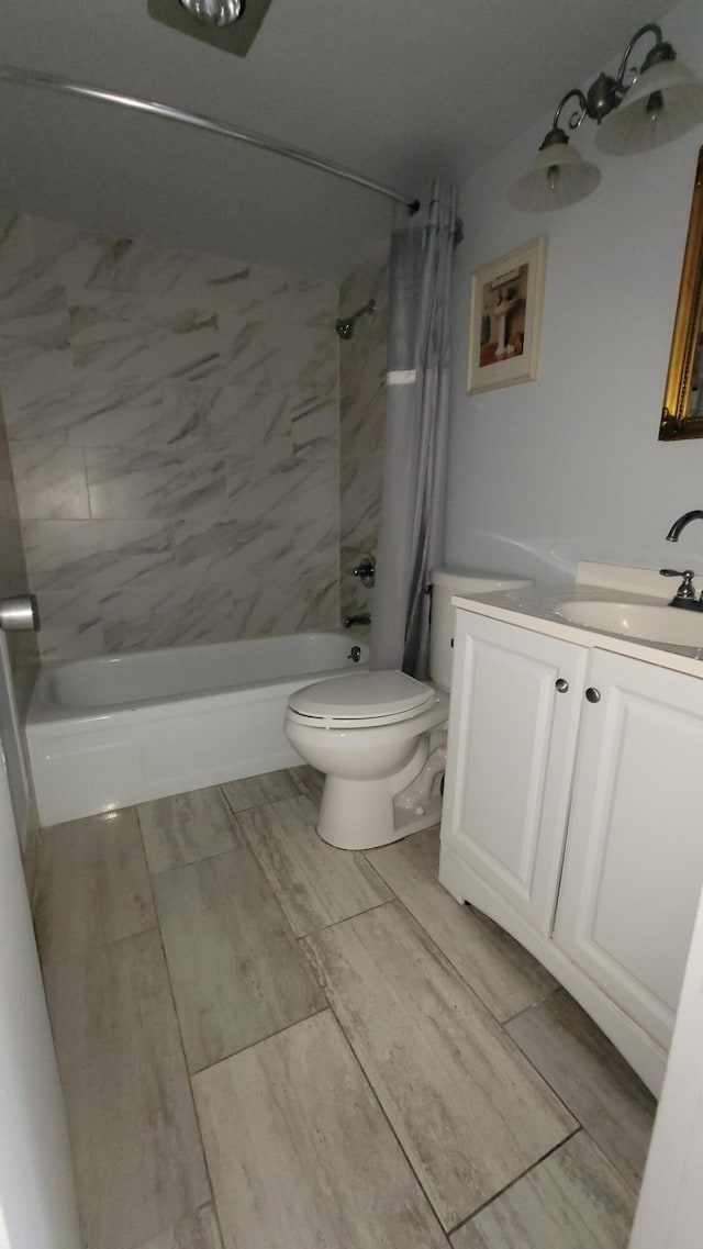 full bathroom featuring vanity, shower / bath combination with curtain, and toilet