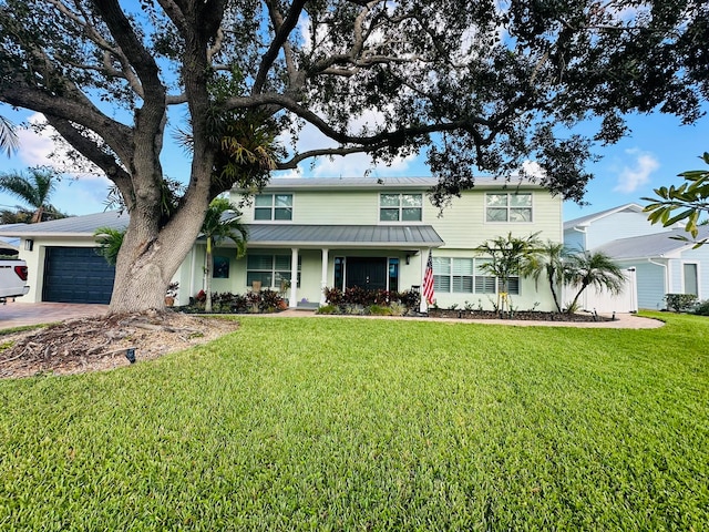 view of front facade with a front lawn and a garage