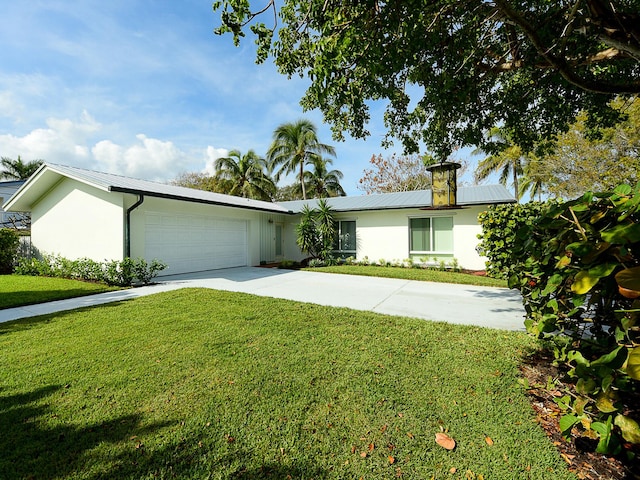 single story home featuring a front yard and a garage