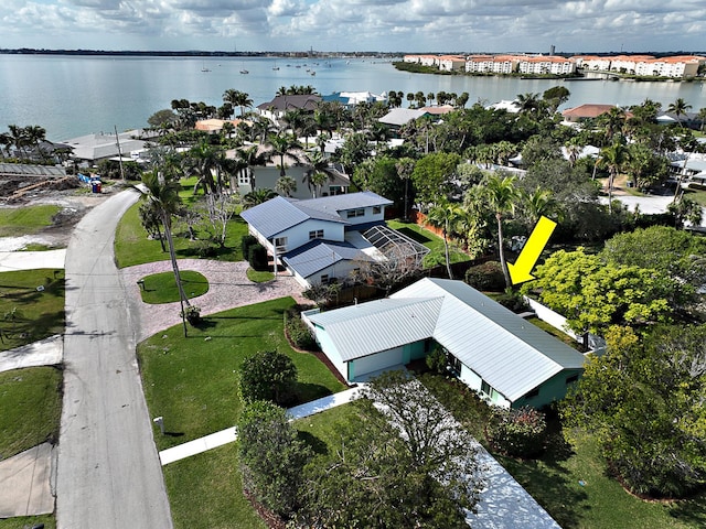 birds eye view of property featuring a water view