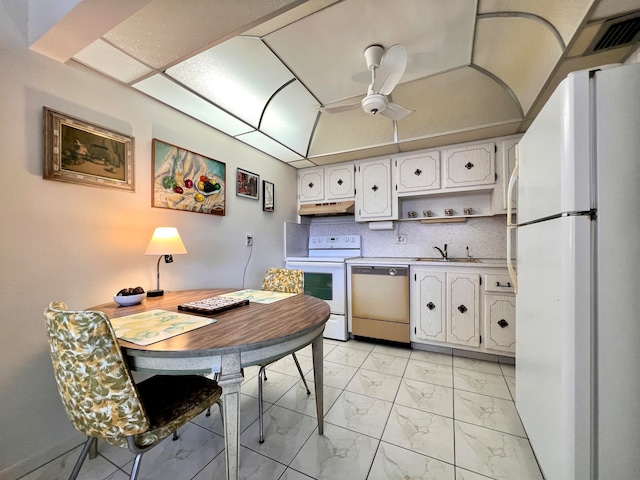 kitchen with ceiling fan, white appliances, sink, light tile floors, and white cabinets