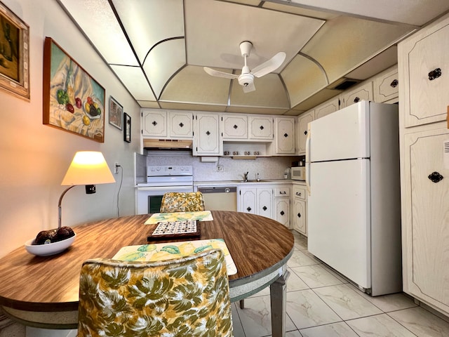 kitchen featuring ceiling fan, white appliances, sink, light tile floors, and white cabinets