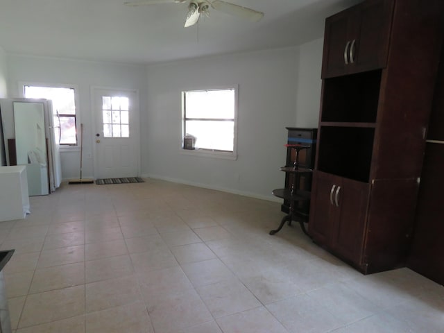 living room with light tile patterned floors and ceiling fan