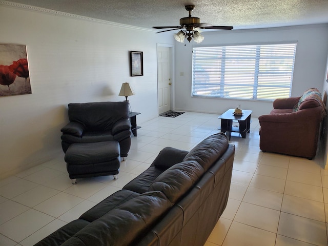 living room with light tile floors, a textured ceiling, and ceiling fan