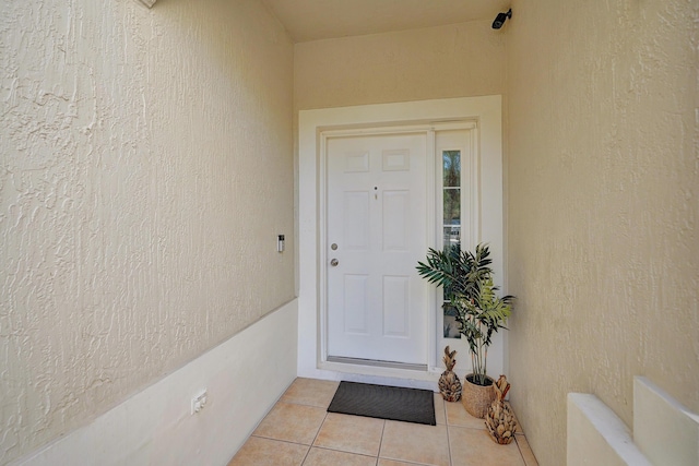 property entrance featuring stucco siding