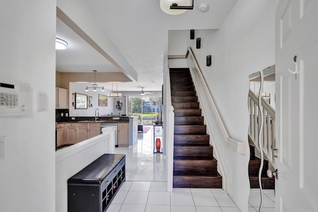 stairs with sink and tile patterned flooring